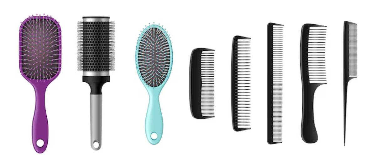 A collection of hair brushes and combs in various shapes, sizes, and colors, displayed neatly in a row.